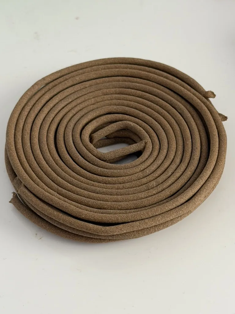 Brown spiral mosquito coils provided for outdoor use at Joyforest